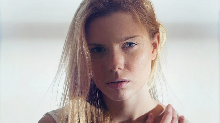 Woman with blonde hair and blue eyes