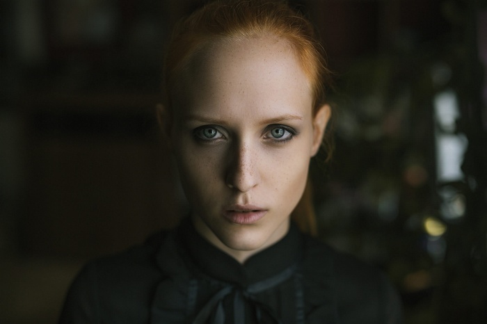 Portrait of a young woman with red hair