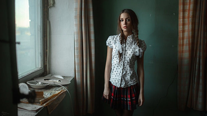 Ksenia Kokoreva with braids and plaid skirt