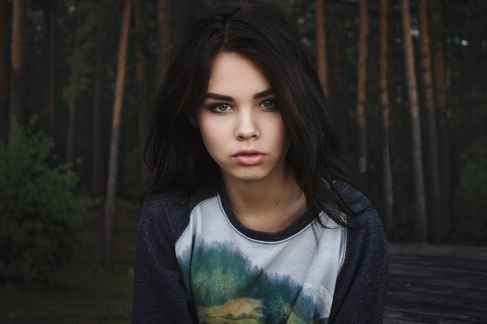 Portrait of a young woman in a forest