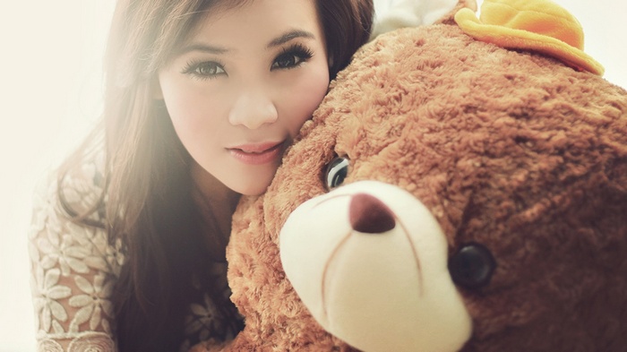 Young woman with a teddy bear