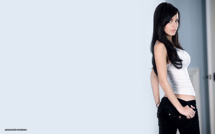Gabriella Fox wearing a white tank top and black jeans