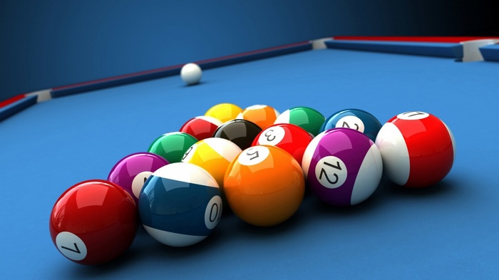 Billiard balls racked on a blue pool table