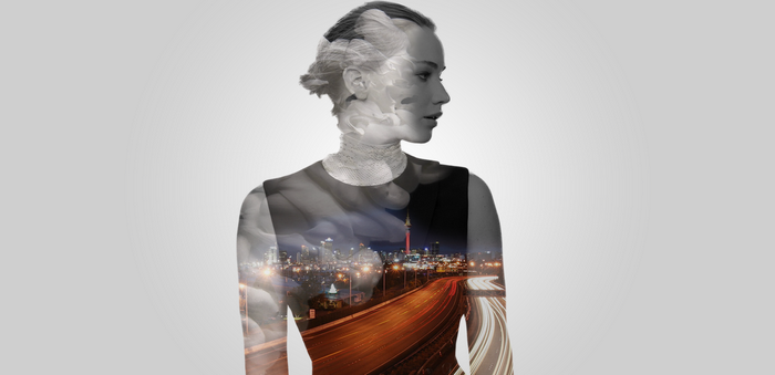 Double exposure of Jennifer Lawrence and city skyline