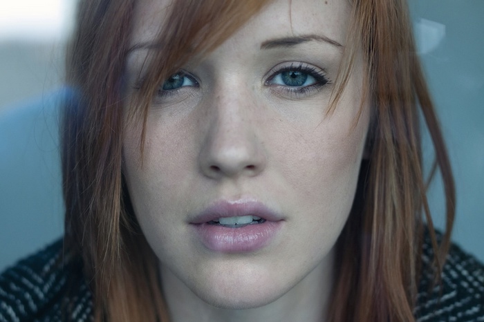 Close-up portrait of a woman with red hair