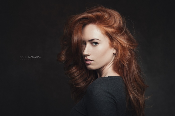 Redhead woman with flowing hair in a portrait