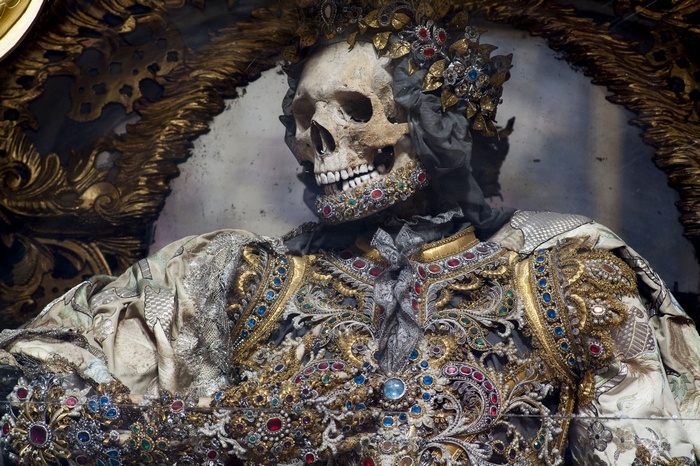 Skeleton adorned with jewels and crown