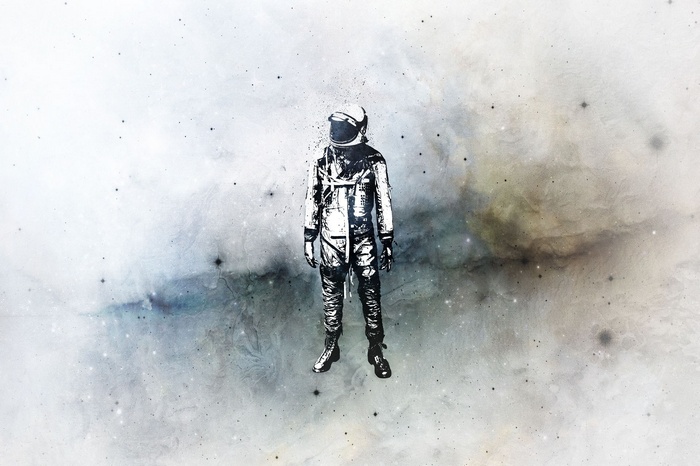 Astronaut standing in space with nebulae