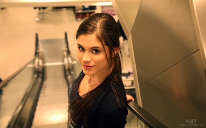 Woman on an escalator