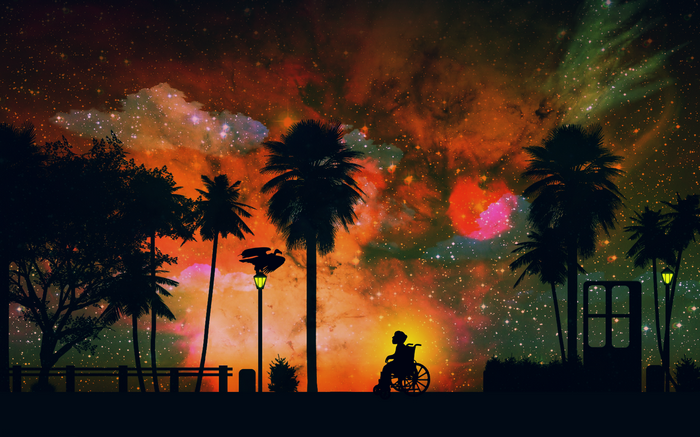 Silhouette of a person in a wheelchair under a starry sky