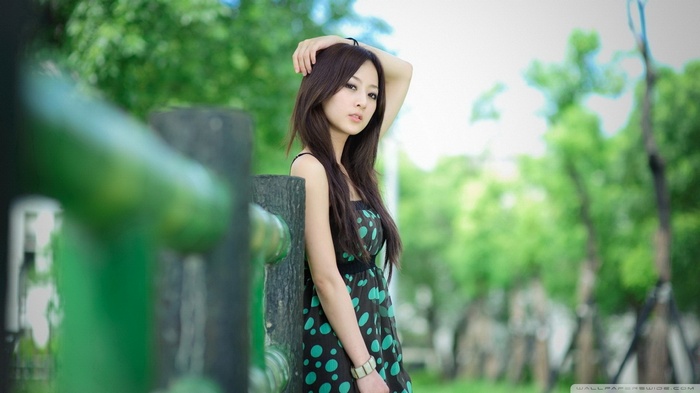 Mikako Zhang Kaijie posing by a fence