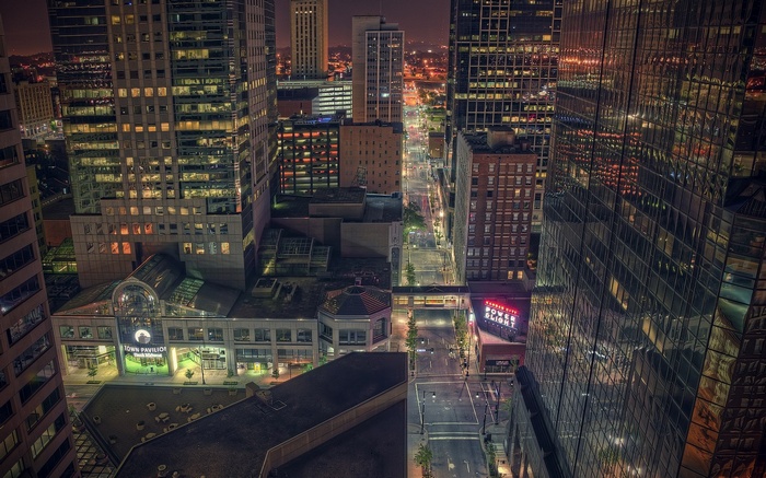 Kansas City cityscape at night with illuminated buildings