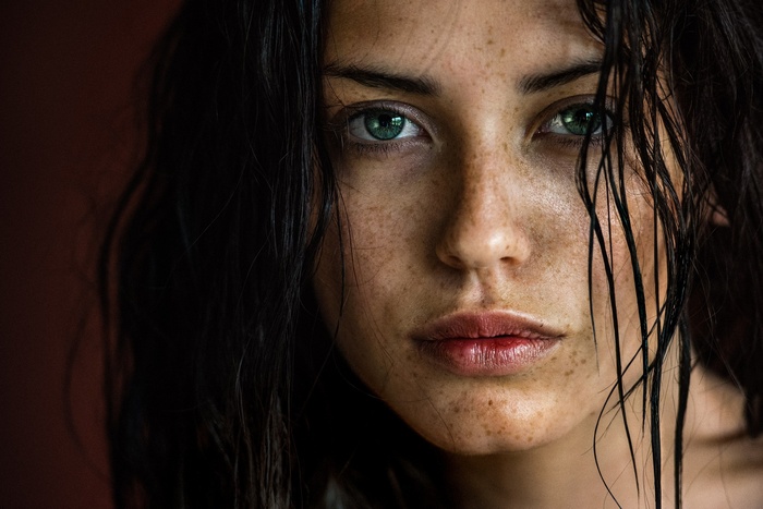 Portrait of a woman with freckles and green eyes