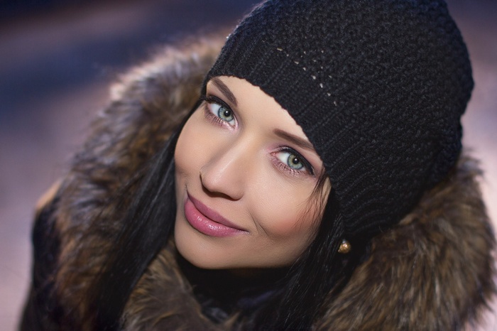 Angelina Petrova wearing a black beanie and fur jacket