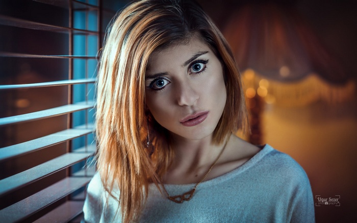 Woman with blonde hair looking at viewer