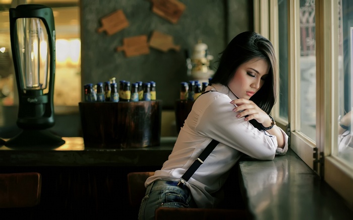 Asian woman with long hair wearing suspenders and white blouse