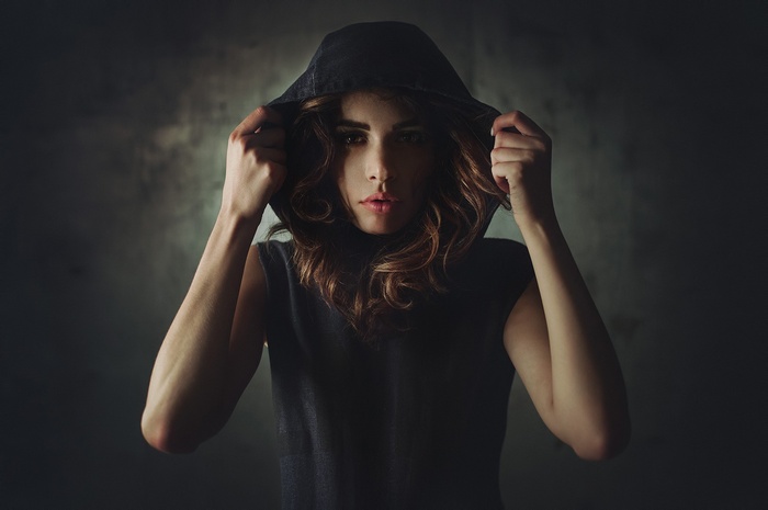 Woman in a dark hoodie