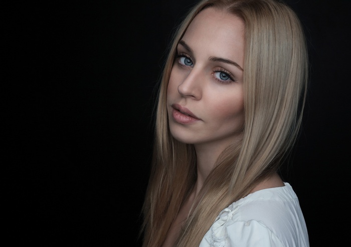 Portrait of a blonde woman with blue eyes