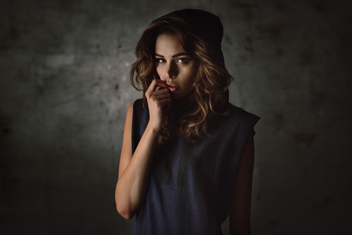 Woman in a black hoodie and dress