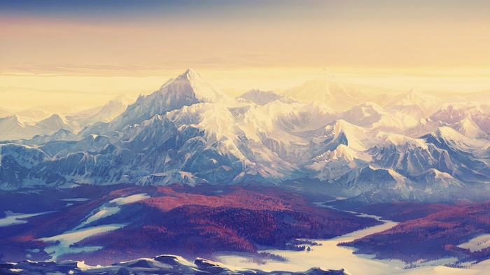 Snow-capped mountains under a golden sky