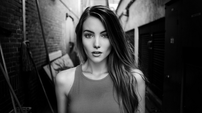 Woman in a tank top in an alley