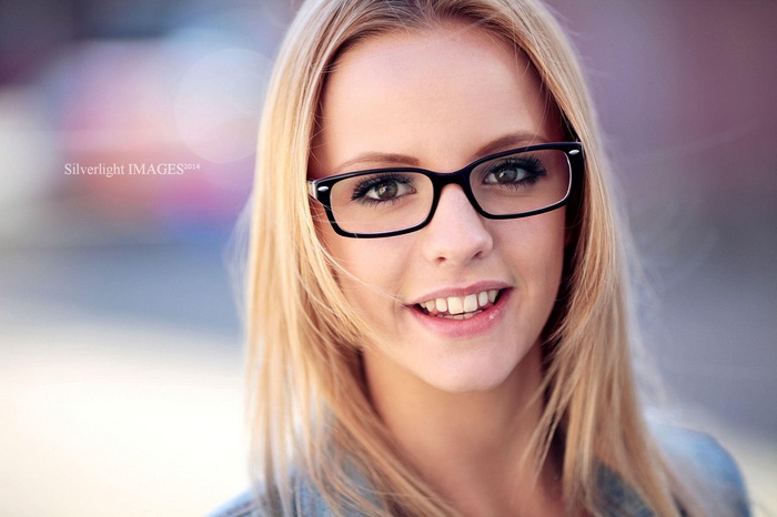 Woman with glasses smiling