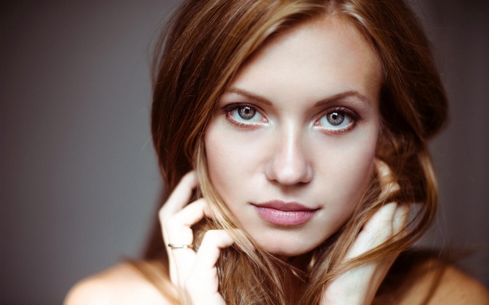 Woman with blonde hair and blue eyes close-up portrait