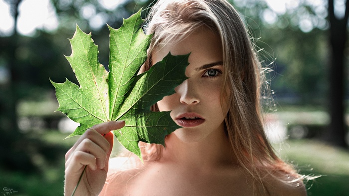 Alexandra Bykova with a leaf in front of her face