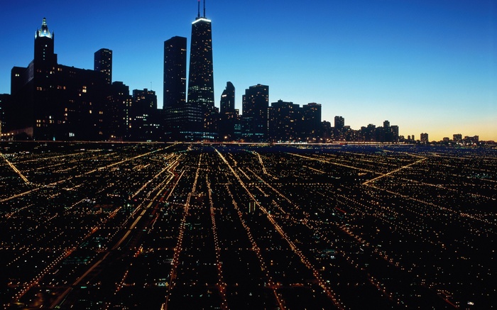 Chicago cityscape at night with illuminated streets