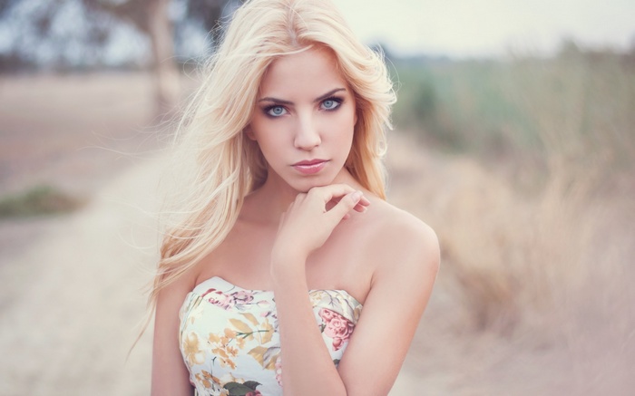 Woman with blonde hair and blue eyes