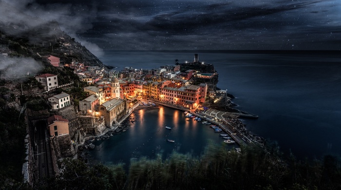 Cinque Terre village at night with stars and sea