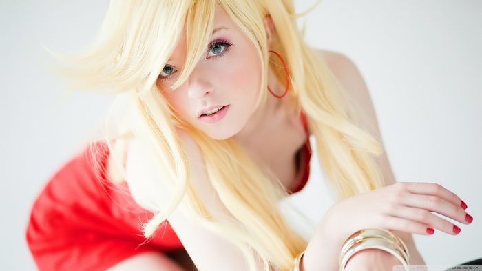 Woman with blonde hair wearing a red dress