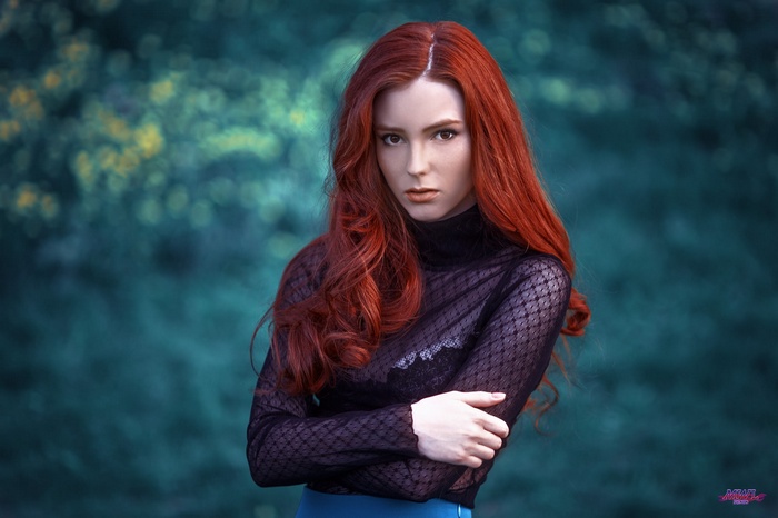 Redhead woman with long wavy hair