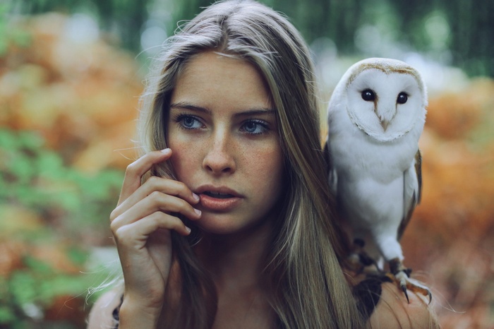 Woman with owl on shoulder