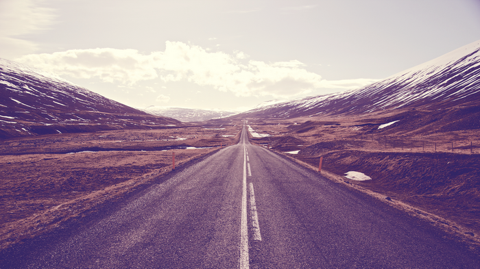 Road through a snowy mountain landscape