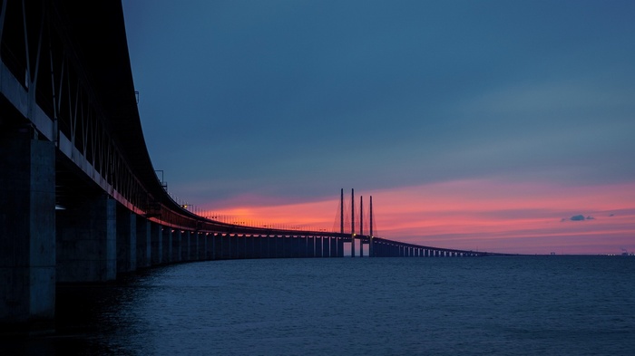 Öresund Bridge at sunset over the sea