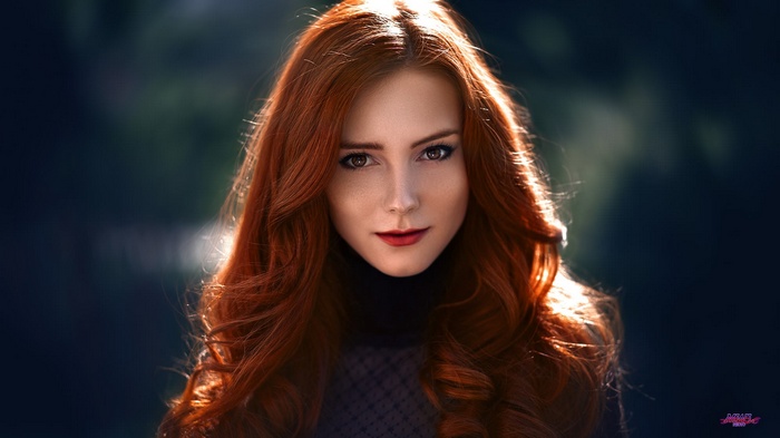 Portrait of a young woman with red hair