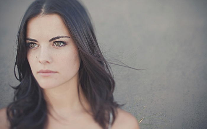 Jaimie Alexander with green eyes and brunette hair