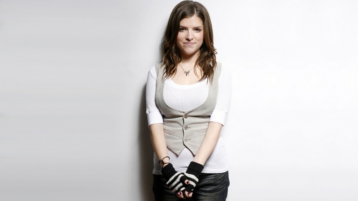 Anna Kendrick wearing a vest and mittens