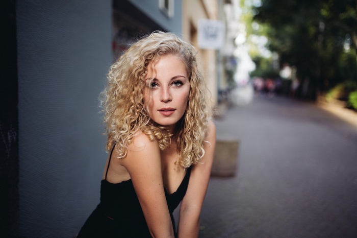 Portrait of a blonde woman with curly hair