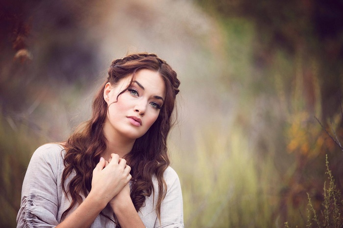 Portrait of a young woman with braided hair