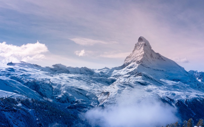 The Matterhorn mountain in the Swiss Alps covered in snow
