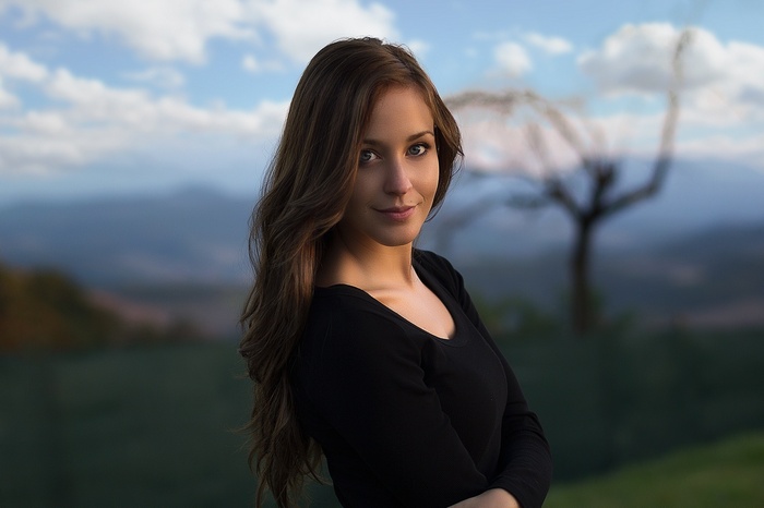 Portrait of a smiling woman with long brown hair