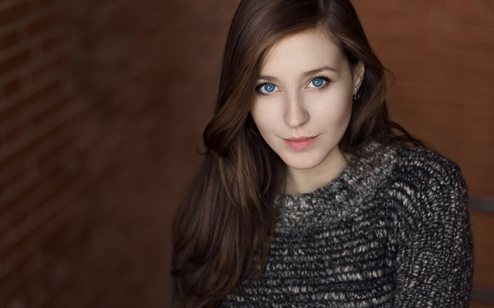 Portrait of Lorenza with blue eyes wearing a sweater