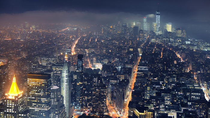 New York City skyline at night with fog