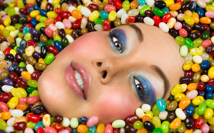 Woman's face surrounded by colorful jelly beans