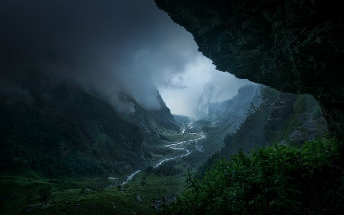 Misty valley with a winding river in France