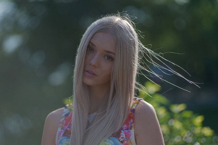 Portrait of a blonde woman with a floral dress