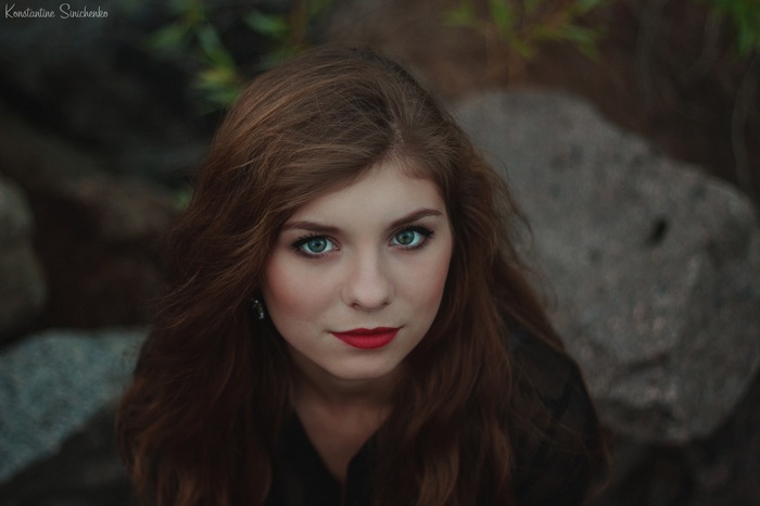 Portrait of a young woman with red lipstick