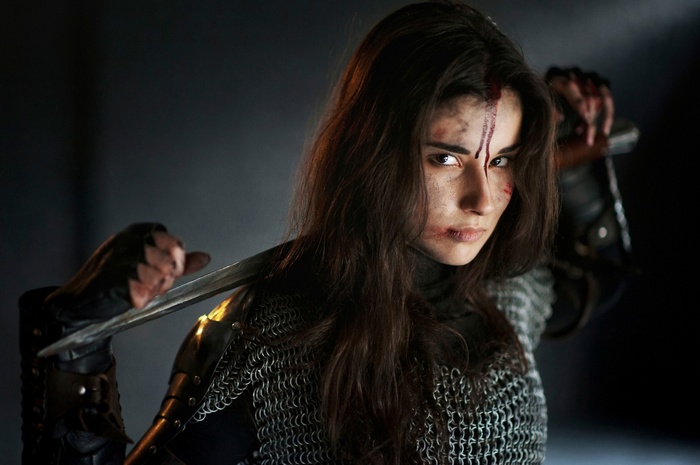 Woman in chainmail holding a sword
